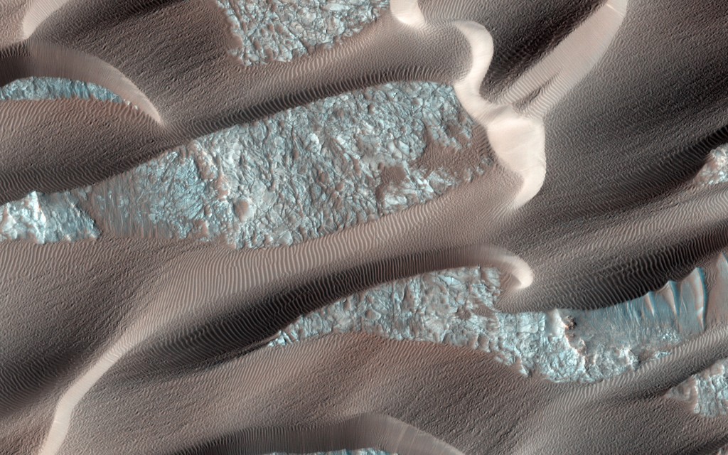 Dunes patterning Nili Patera caldera on Mars, caught by the HIRISE camera on the Mars Reconnaisance Orbiter. From The Planets (Chronicle Books) by Nirmala Nataraj. 