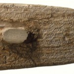 Carved rows of animals, including elephants, lions, a giraffe, and sheep, cover both sides of the ivory handle of a ritual knife from the Predynastic Period in Egypt.