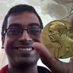 Nishchal Dwivedi holding the Nobel Prize medal of Klaus von Klitzing, 1985 physics Nobel Laureate. Klitzing let the participants take pictures with his prize to encourage them to feel how approachable it is.