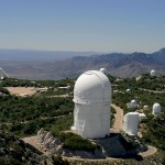 Telescopes atop Kitt Peak, in Arizona, include the NOAO's 4-metre Mayall telescope (foreground).